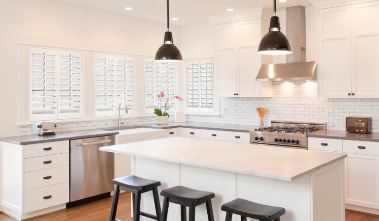 Plantation shutters in a bright New York kitchen.